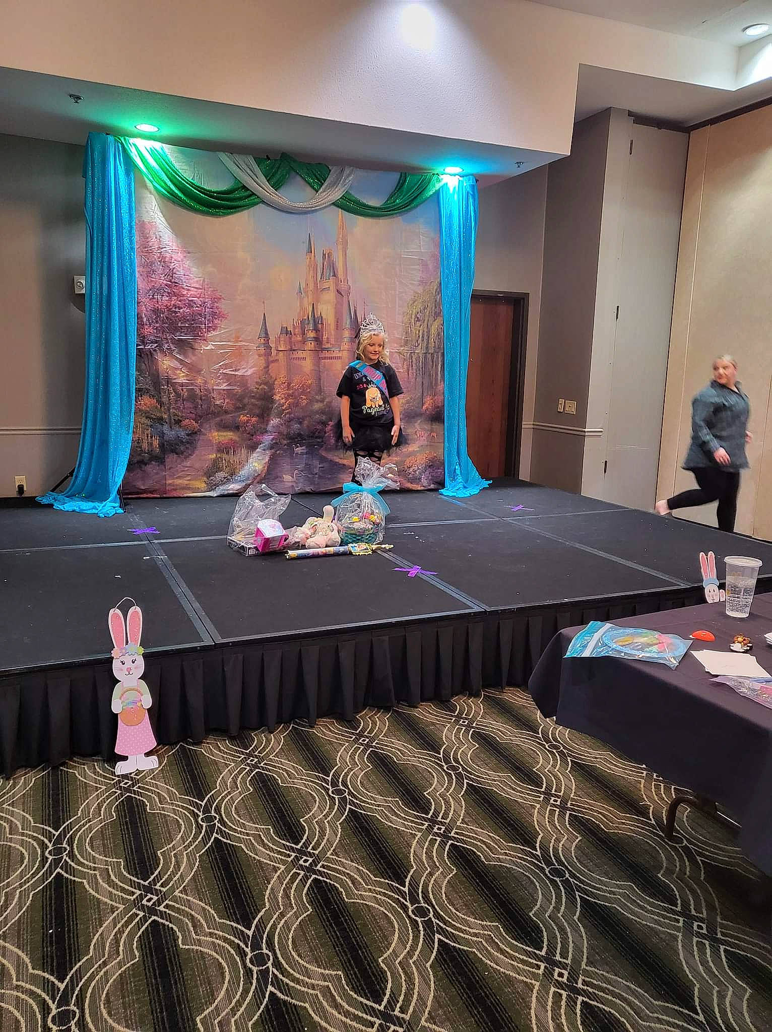 Raelynn is registered to the contest to win money with this photo: architecture, beauty, carpet, curtain, display_device, entertainment, event, fashion, fashion_design, floor, flooring, joy, leisure, lighting, magenta, person, purple, recreation, stage, technology