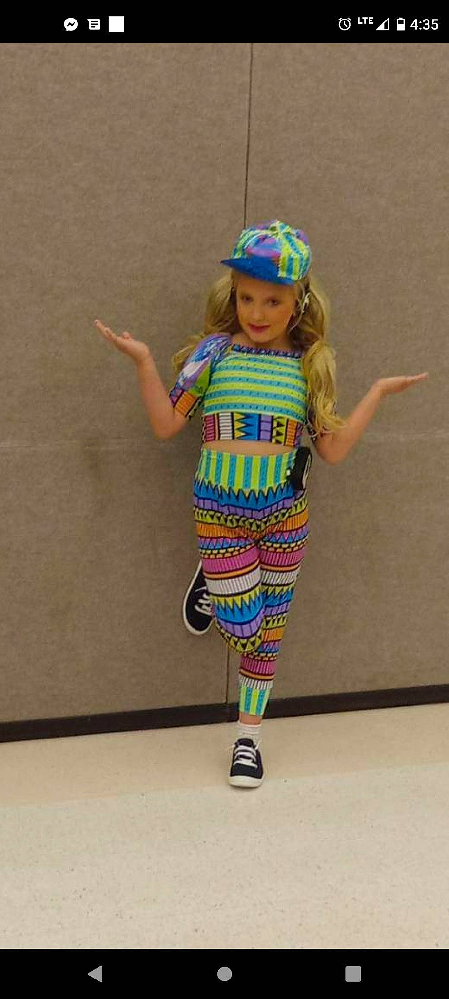 Raelynn is registered to the contest to win money with this photo: baby_toddler_clothing, baseball_cap, cap, dress, electric_blue, face, fashion_design, happy, headwear, human_leg, joint, joy, knee, leg, magenta, neck, person, pink, sleeve, t_shirt