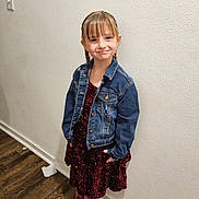 Courtney joined the competition — help win amazing prizes! child, girl, young_girl, braids, bangs, freckles, denim_jacket, sequined_dress, burgundy_dress, cowboy_boots, smile, portrait, indoor, wall, textured_wall, hardwood_floor, standing, hands_in_pockets, light_switch, paper_on_floor