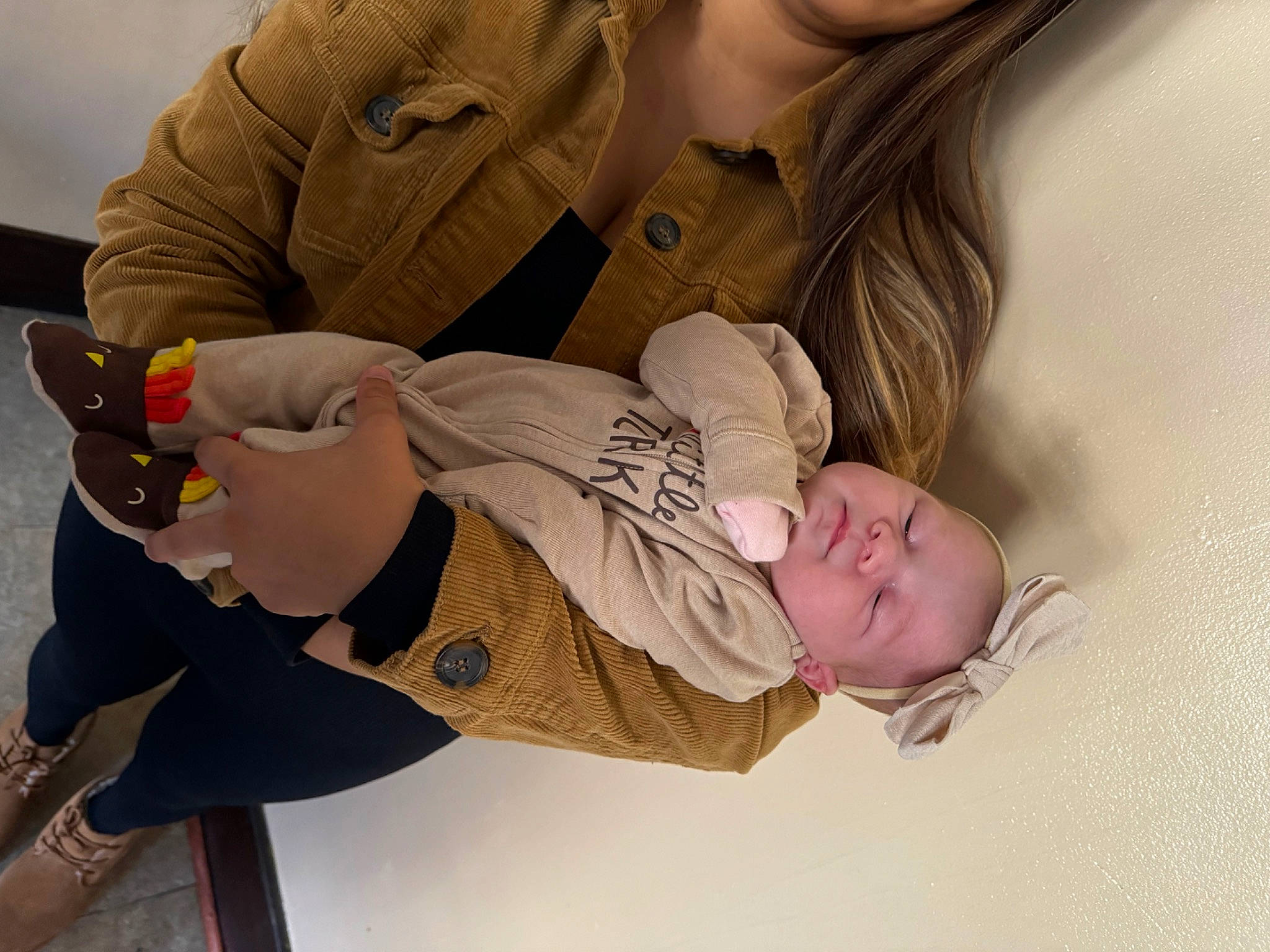 Isabella is registered to the contest to win money with this photo: abdomen, baby, baby_products, baby_toddler_clothing, child, comfort, elbow, fun, gesture, human_leg, joint, knee, nail, pattern, person, sitting, sleeve, sunglasses, thigh, thumb