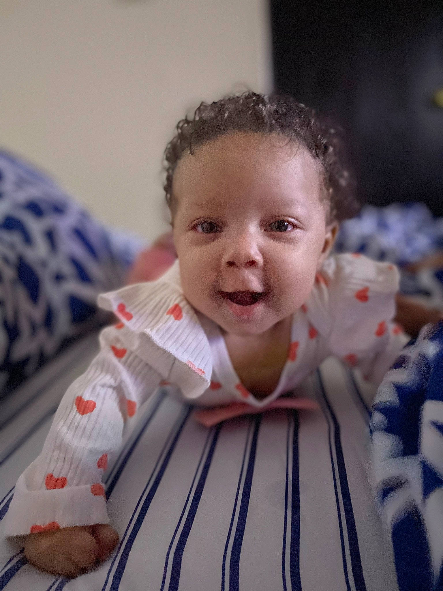 Alayah is registered to the contest to win money with this photo: baby, baby_toddler_clothing, cheek, child, chin, comfort, dress, eye, face, flash_photography, flooring, happy, head, linens, nose, person, sitting, skin, sleeve, smile