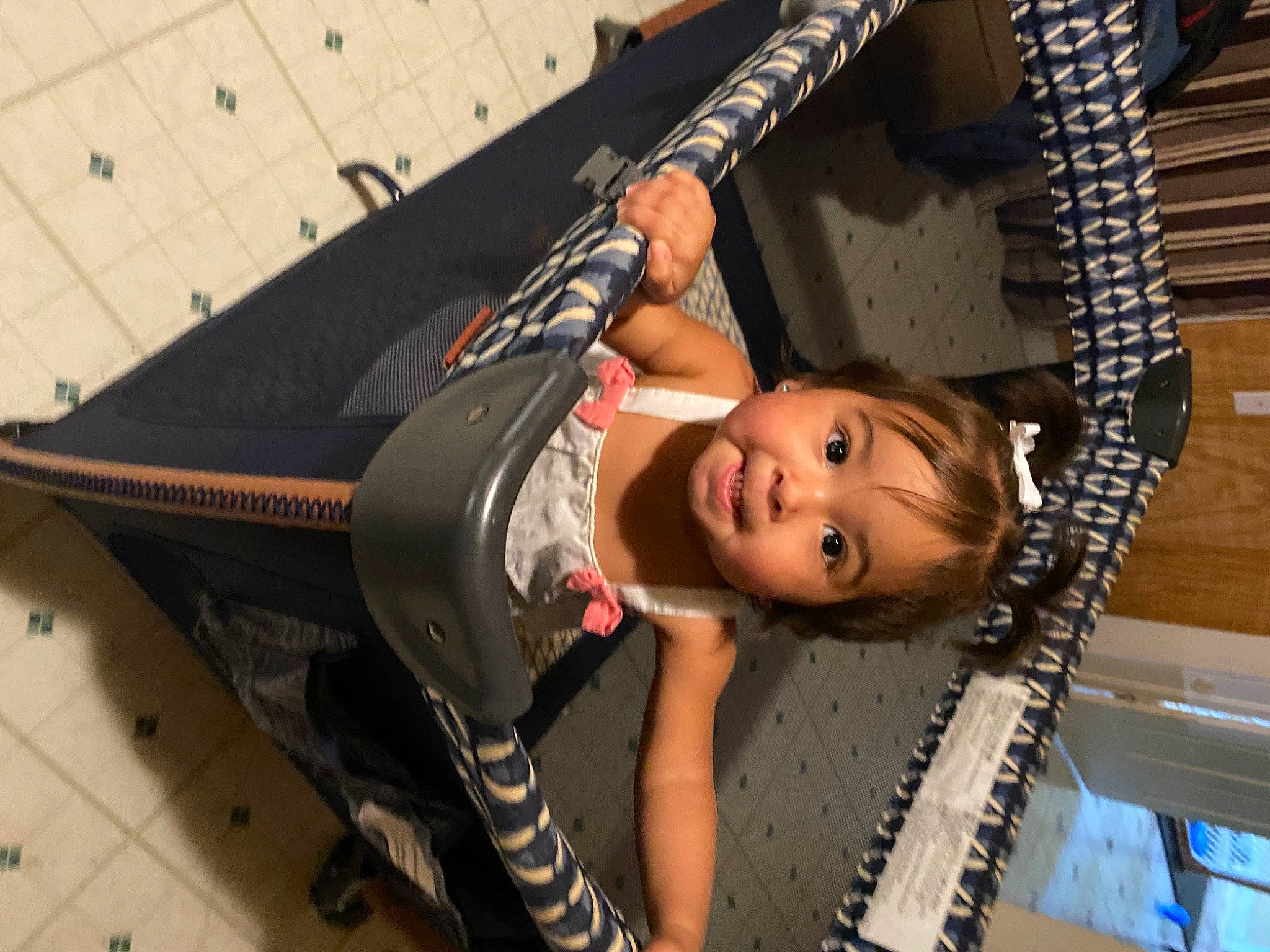 Liberty is registered to the contest to win money with this photo: baby_products, child, flash_photography, fun, leisure, metal, person, smile, toddler, transport, wood