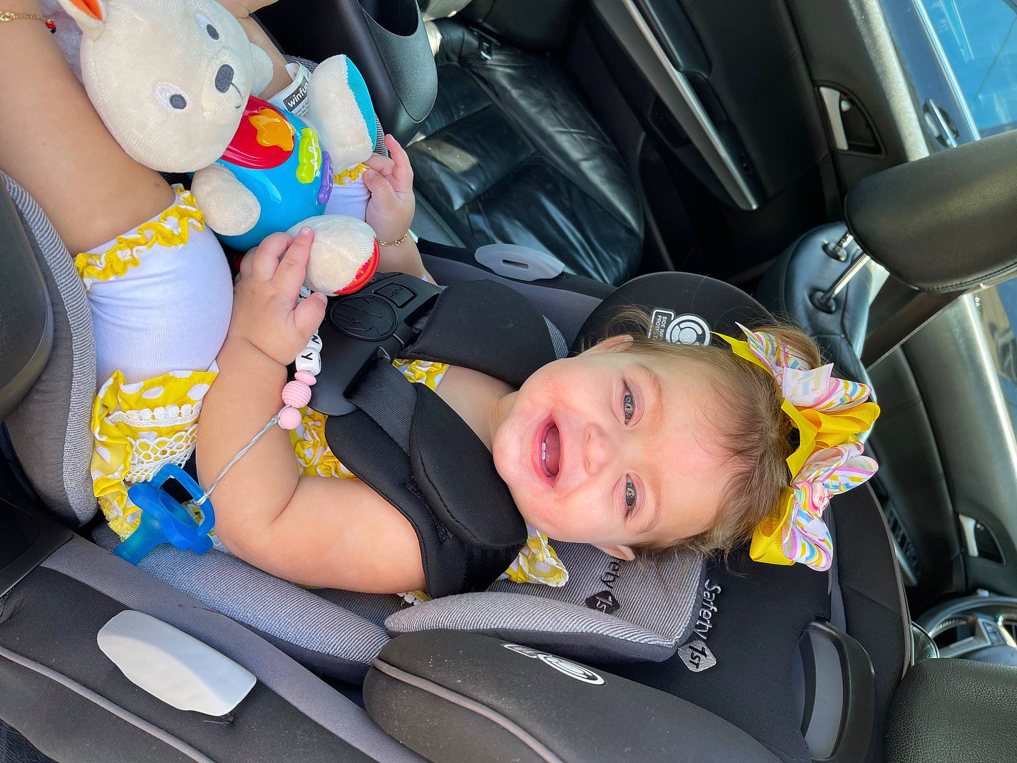 Arianny joined the competition — help win amazing prizes! automotive_design, automotive_exterior, baby_in_car_seat, car, car_seat, car_seat_cover, comfort, head_restraint, leg, motor_vehicle, person, seat_belt, smile, steering_part, steering_wheel, toddler, vehicle, vehicle_door, white, window