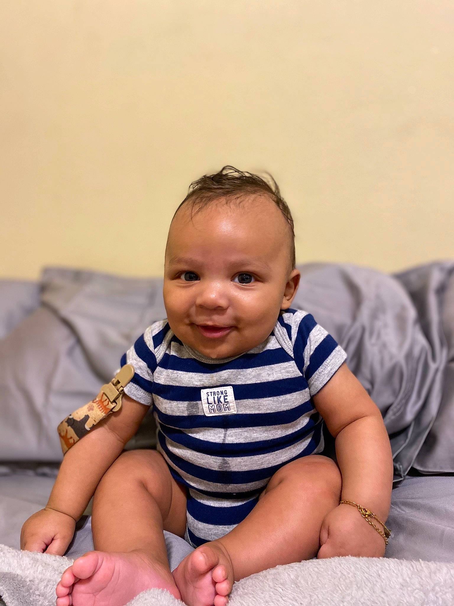 Micheal is registered to the contest to win money with this photo: baby, baby_toddler_clothing, cheek, chin, comfort, dress, face, facial_expression, finger, flash_photography, hairstyle, happy, iris, joint, joy, person, product, skin, sleeve, smile