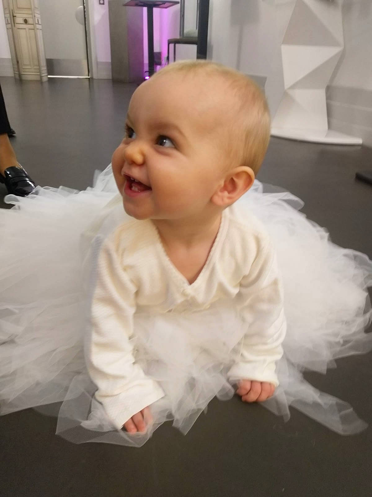 Malvina participe au concours pour gagner de l'argent avec cette photo : baby, baby_toddler_clothing, cheek, child, dress, event, floor, flooring, formal_wear, fun, gesture, hairstyle, happy, hardwood, iris, person, pink, skin, sleeve, smile
