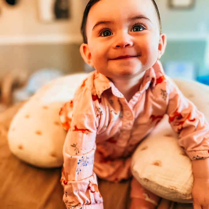 Nezuko joined the competition — help win amazing prizes! baby, bed, child, cute, eyes, face, hair, happy, home, indoors, infant, patterned_clothing, person, pillow, portrait, shirt, skin, smiling, toddler, young_child