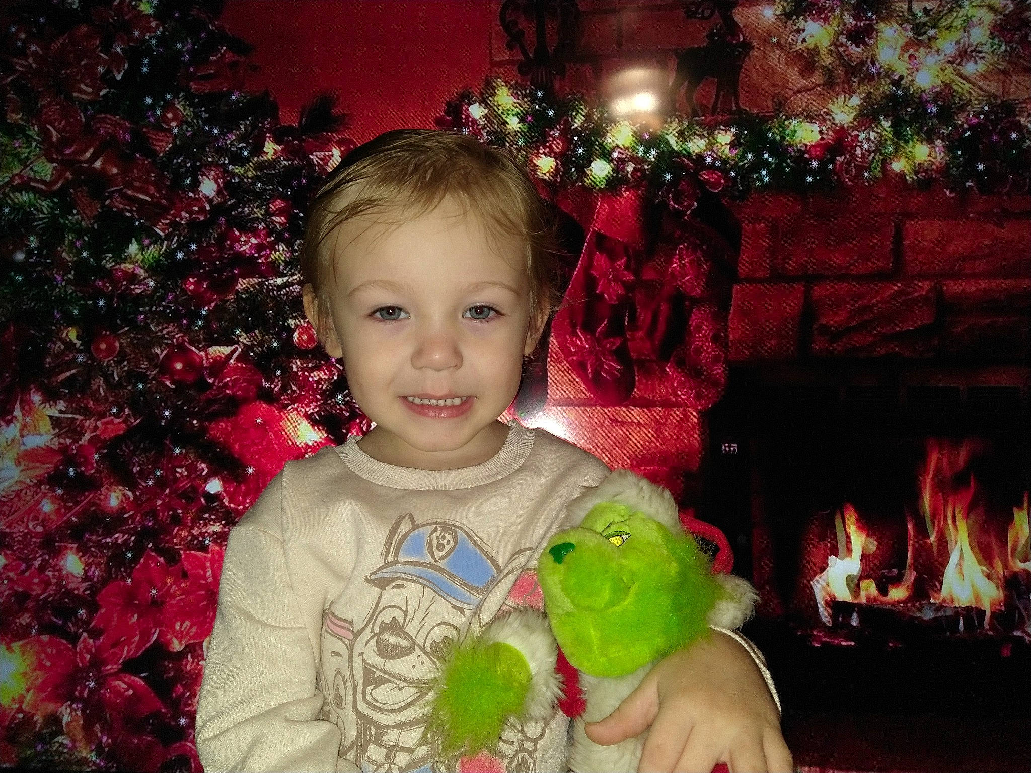 Azzy is registered to the contest to win money with this photo: baby_toddler_clothing, beauty, child, christmas_decoration, christmas_ornament, christmas_tree, event, eye, face, fun, happy, head, iris, joy, leaf, people, person, photograph, pink, smile