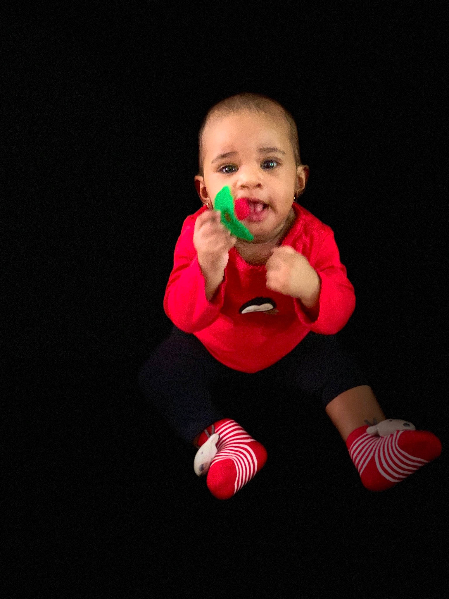 Kharlie is registered to the contest to win money with this photo: baby, baby_toddler_clothing, ball, child, face, finger, flash_photography, flooring, fun, gesture, grass, hand, happy, human_leg, knee, magenta, person, sitting, sleeve, sock