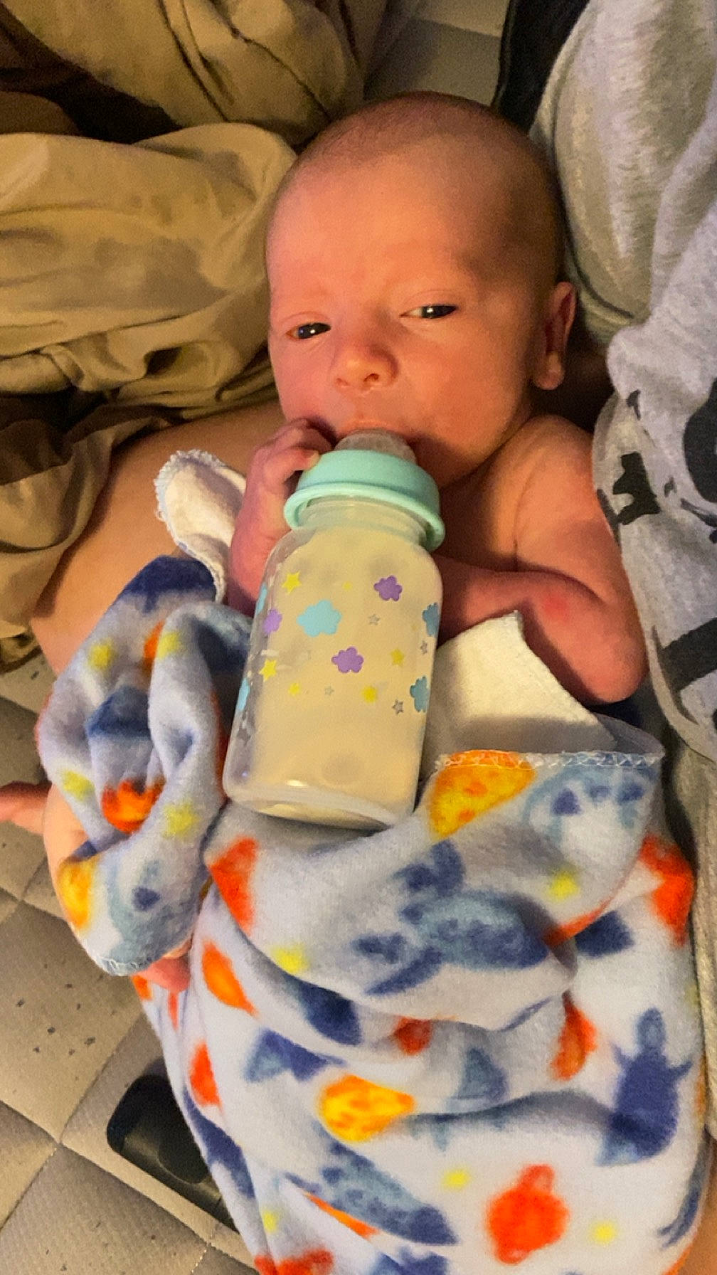 James joined the competition — help win amazing prizes! baby, baby_bottle, baby_products, bottle, cheek, child, comfort, drinkware, hand, head, human_body, nail, person, plastic, plastic_bottle, service, sitting, skin, toddler, toy