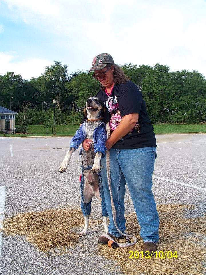 Hoyt is registered to the contest to win money with this photo: carnivore, cloud, dog_breed, fawn, footwear, gesture, grass, happy, jeans, landscape, leg, leisure, people_in_nature, plant, recreation, shoe, sky, sneakers, sunglasses, tree