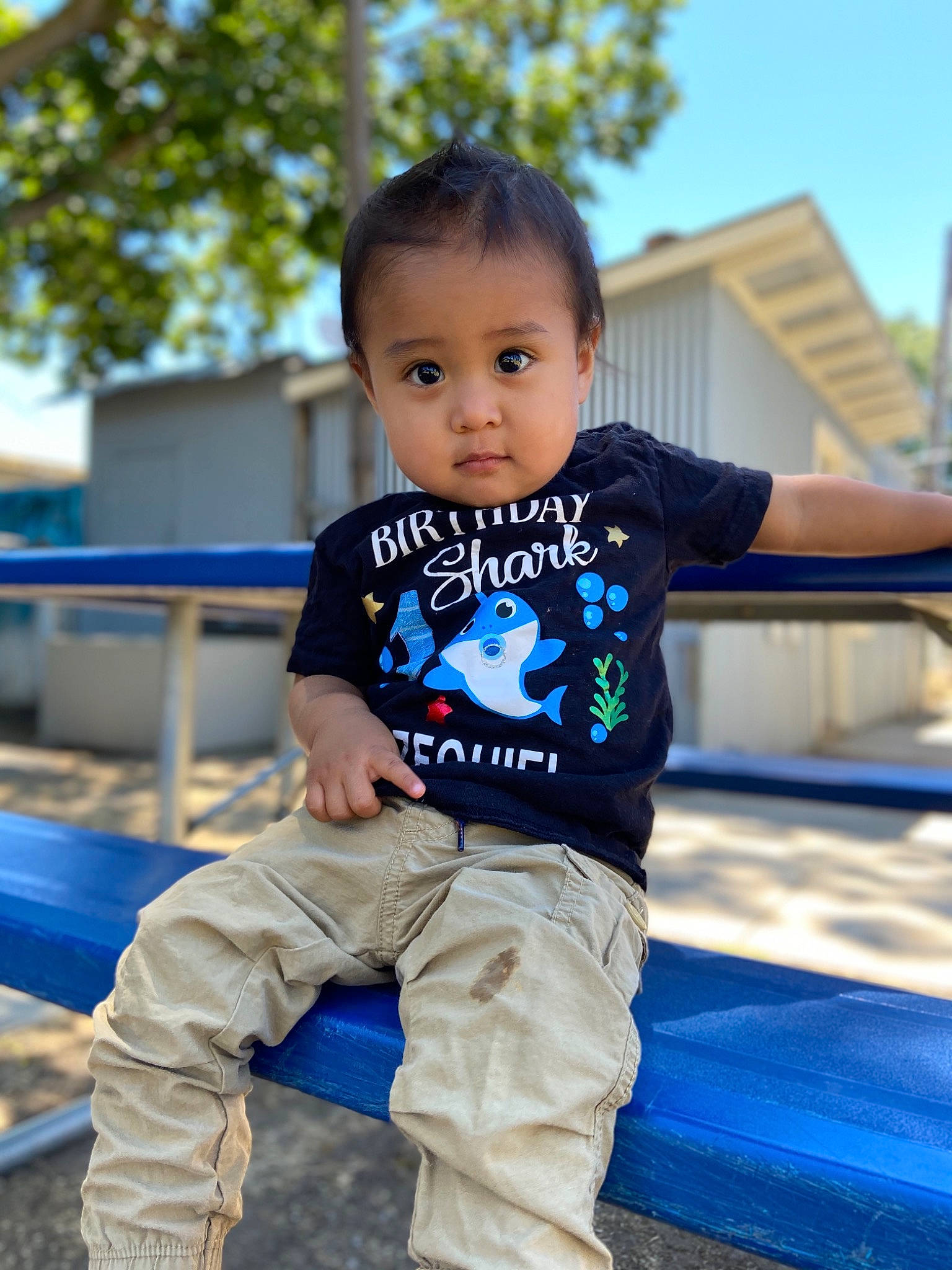 Ezequiel is registered to the contest to win money with this photo: baby, blue, child, child_model, jeans, person, sitting, sleeve, smile, standing, t_shirt, toddler, vacation
