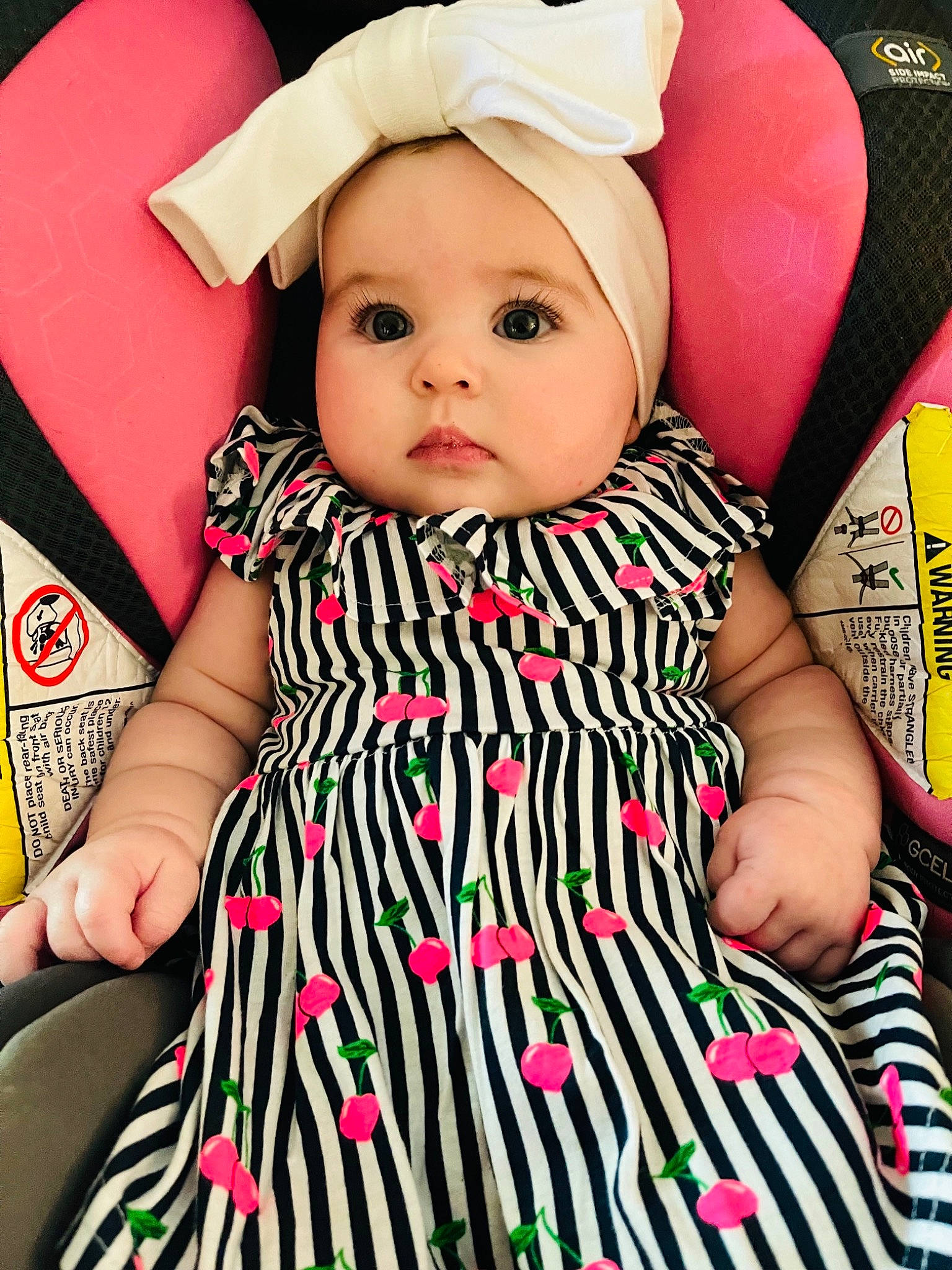 Rylee Grace is registered to the contest to win money with this photo: baby, baby_toddler_clothing, cap, cheek, child, day_dress, dress, eyelash, face, facial_expression, happy, headgear, headwear, lip, magenta, outerwear, person, pink, skin, sleeve