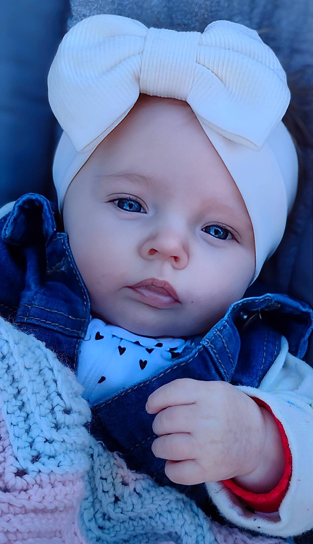 Averee is registered to the contest to win money with this photo: baby, bodypart, bonnet, cap, clothing, coat, cosmetics, face, finger, hand, hat, head, jacket, jeans, knitwear, lipstick, pants, person, photography, portrait