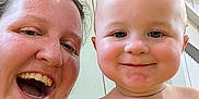 Andrew is registered to the contest to win money with this photo: adult, baby, child, face, happy, indoor, person, portrait, smile, toddler, wood, workshop, background, tools, wall, closeup, skin, expression, casual, fun
