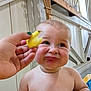 Andrew joined the competition — help win amazing prizes! baby, child, face, expression, lemon, hand, skin, indoor, wood, grime, funny, emotion, candid, person, closeup, tongue, sour, unimpressed, cute, plump