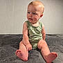 Andrew joined the competition — help win amazing prizes! baby, child, infant, sitting, green_onesie, zebra_print, curious, soft_blanket, gray_blanket, toes, chubby_cheeks, indoor, wall, cute, portrait, young_child, skin, head, arm, leg