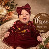 autumn, baby, blanket, bow, child, cute, floral, flower, happy, headband, indoors, infant, knit, maroon_dress, portrait, sign, sitting, smiling, three_months, wooden_sign
