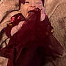 baby, child, infant, smiling, happy, maroon, bow, headband, blanket, soft, fabric, playful, cute, clothing, hand, sitting, portrait, indoor, person, cozy