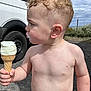 Mason is registered to the contest to win money with this photo: child, toddler, ice_cream, cone, milk_mustache, curly_hair, shirtless, outdoor, vehicle, van, cloudy_sky, gravel, nature, summer, food, dessert, person, young_child, hand, expression