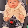 baby, infant, car_seat, maxi_cosi, knit_sweater, floral_dress, tights, shoes, seatbelt, child, cute, portrait, indoors, sitting, young, baby_clothing, face, hands, legs, comfort