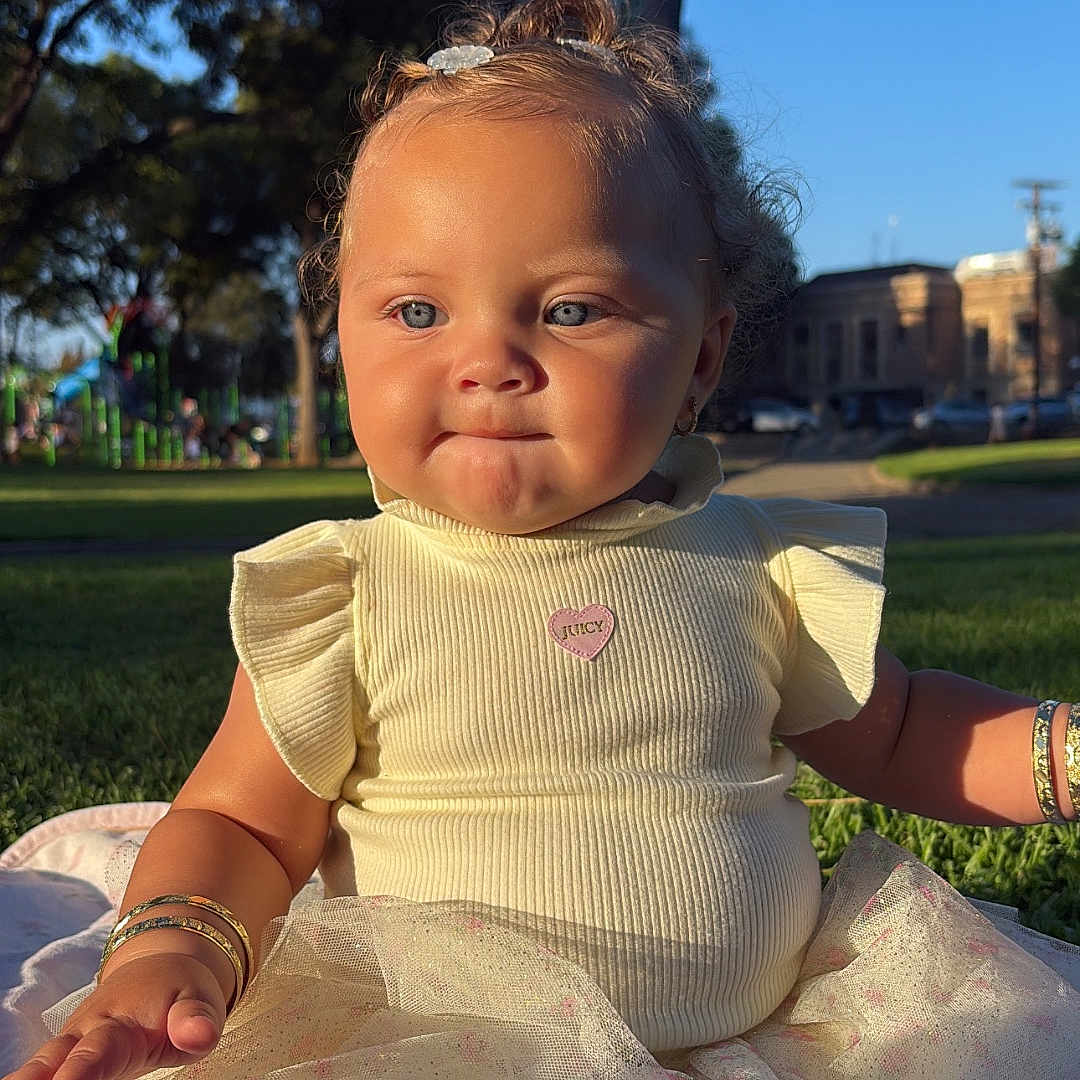 Alani joined the competition — help win amazing prizes! toddler, child, outdoor, park, grass, sunlight, blue_sky, dress, bracelet, blanket, cute, portrait, baby, sitting, daylight, nature, fashion, happy, young, person