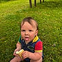Wesley is registered to the contest to win money with this photo: baby, child, ice_cream, grass, outdoor, summer, messy, tongue_out, cute, sitting, food, cone, greenery, picnic_bench, casual_clothing, sunny, playful, happy, nature, infant