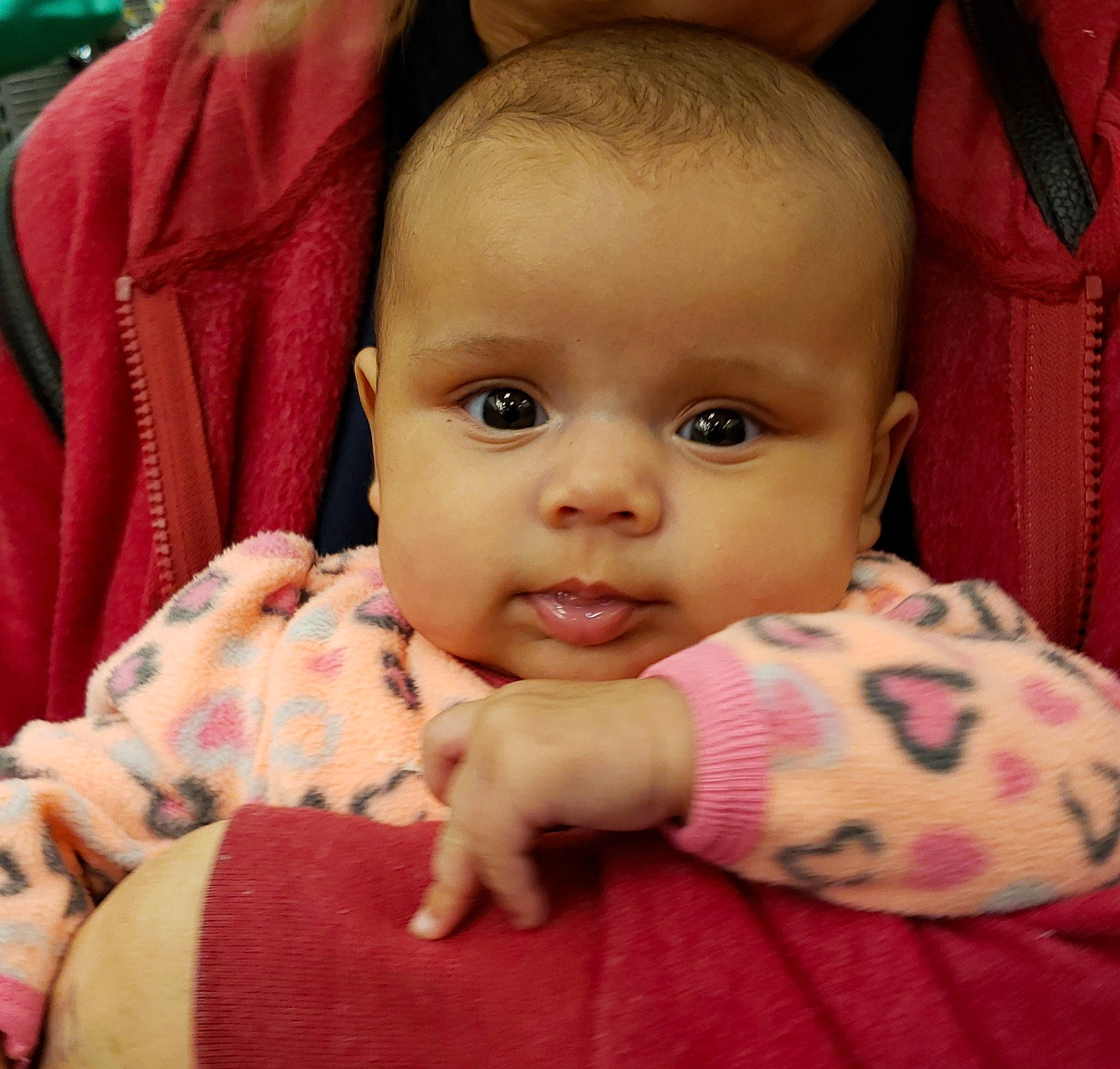 Grae is registered to the contest to win money with this photo: baby, cheek, child, ear, eye, face, finger, forehead, head, iris, lip, mouth, nose, person, pink, skin, smile, thumb, toddler