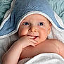 Meïr participe au concours pour gagner de l'argent avec cette photo : adorable, baby, bath_time, blanket, blue_towel, chubby_cheeks, close_up, cozy, eyes, fingers, hand, hooded_towel, infant, looking_up, lying_down, portrait, skin, smile, soft_texture, towel