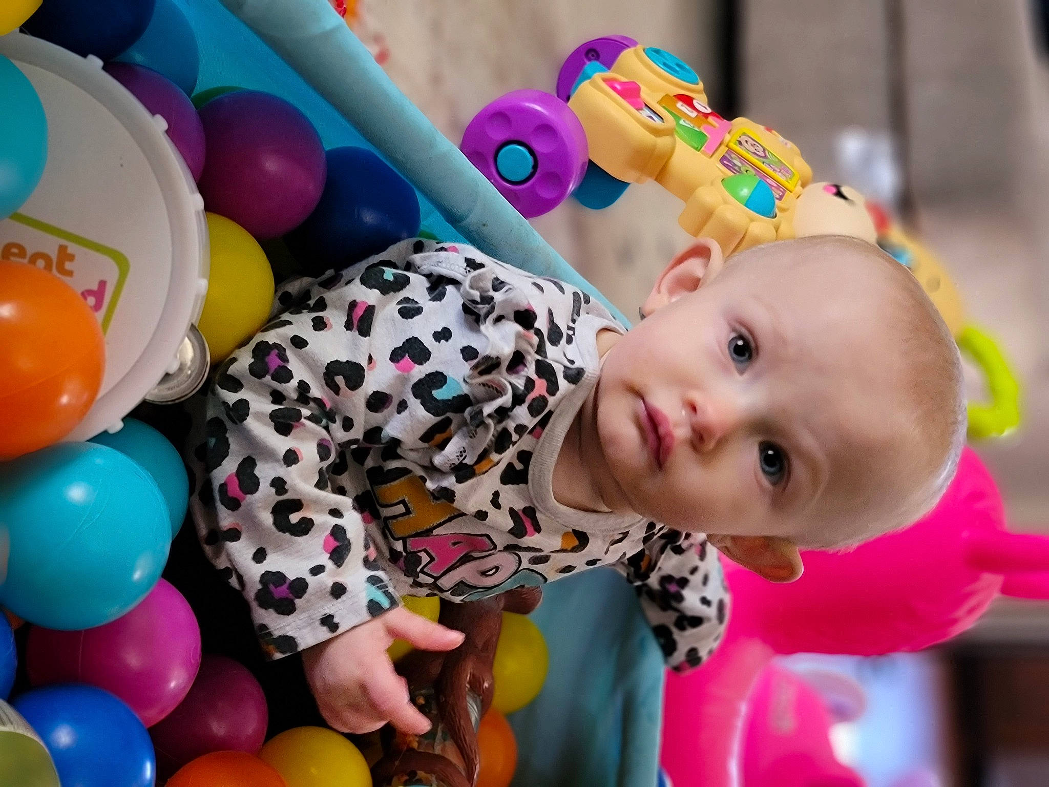 Elyza is registered to the contest to win money with this photo: baby, balloon, beauty, child, event, facial_expression, fun, happy, leisure, mammal, party_supply, people, person, photograph, pink, product, smile, snapshot, toddler, toy