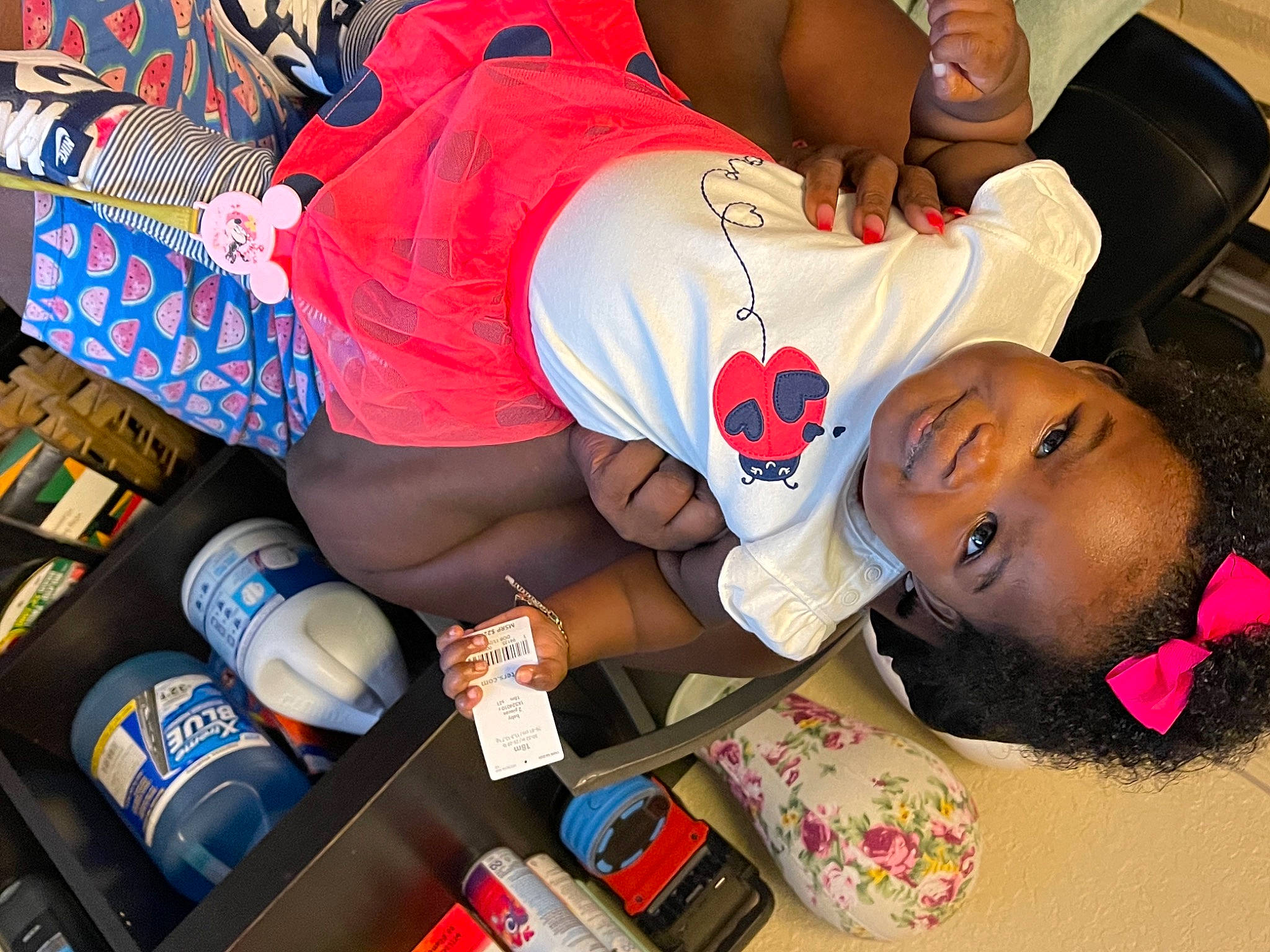 Janice is registered to the contest to win money with this photo: aluminum_can, baseball_cap, beer, carmine, child, elbow, event, fun, happy, hat, human_leg, joy, nail, pattern, person, product, room, shorts, sportswear, t_shirt