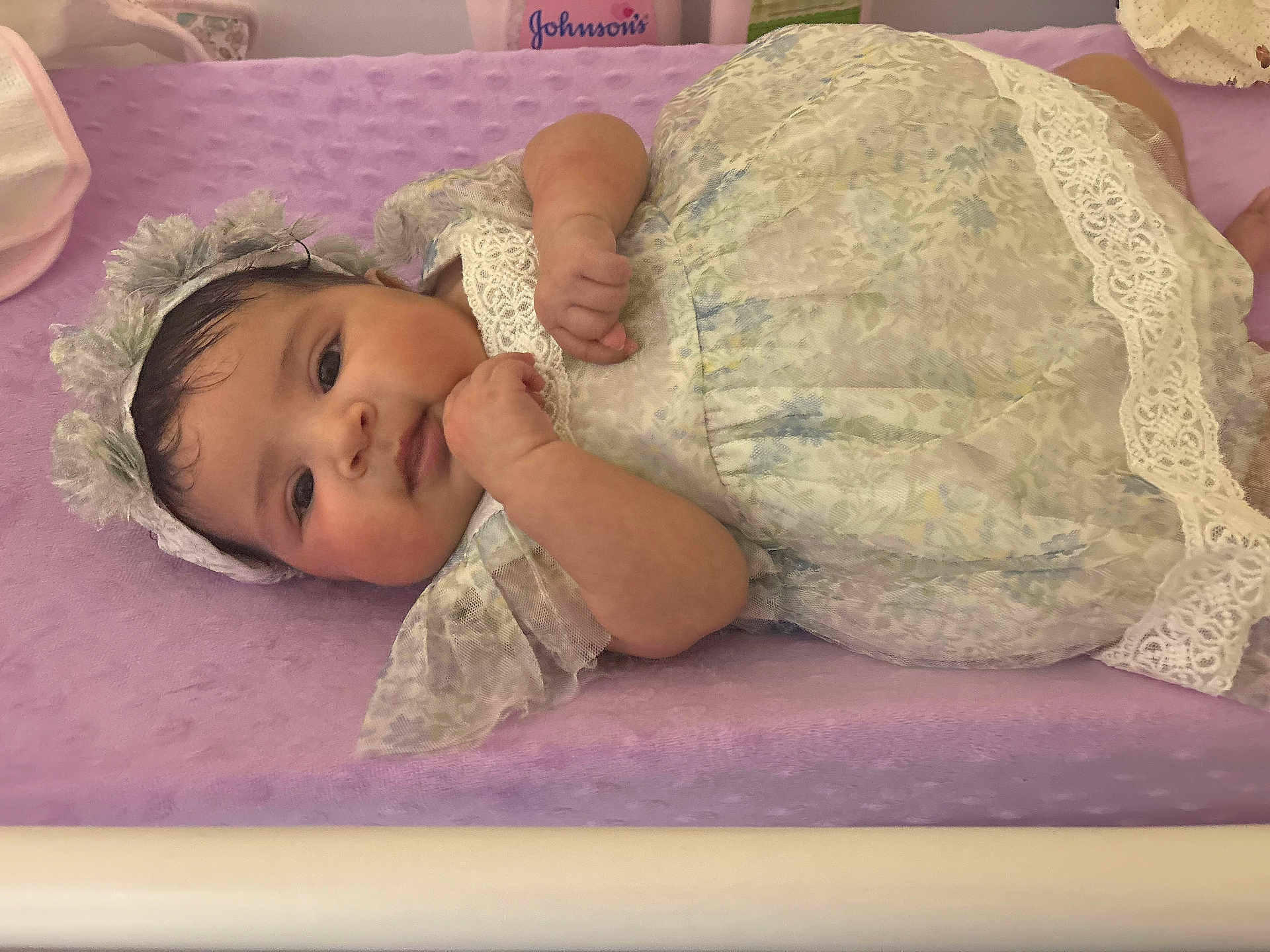 Avianna joined the competition — help win amazing prizes! baby, infant, child, lace_dress, headband, purple_blanket, lying_down, soft_texture, indoors, cute, portrait, newborn, calm, small_hands, face, skin, black_hair, resting, closeup, adorable