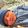 baby, blanket, blue_clothing, child, closeup, cozy, cute, face, hat, indoors, infant, newborn, peaceful, portrait, resting, sleep, sleeping, soft, warm, young
