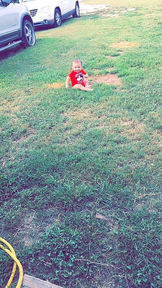 Jayden is registered to the contest to win money with this photo: backyard, garden, grass, lawn, person, plant, play, tree, vehicle, yard