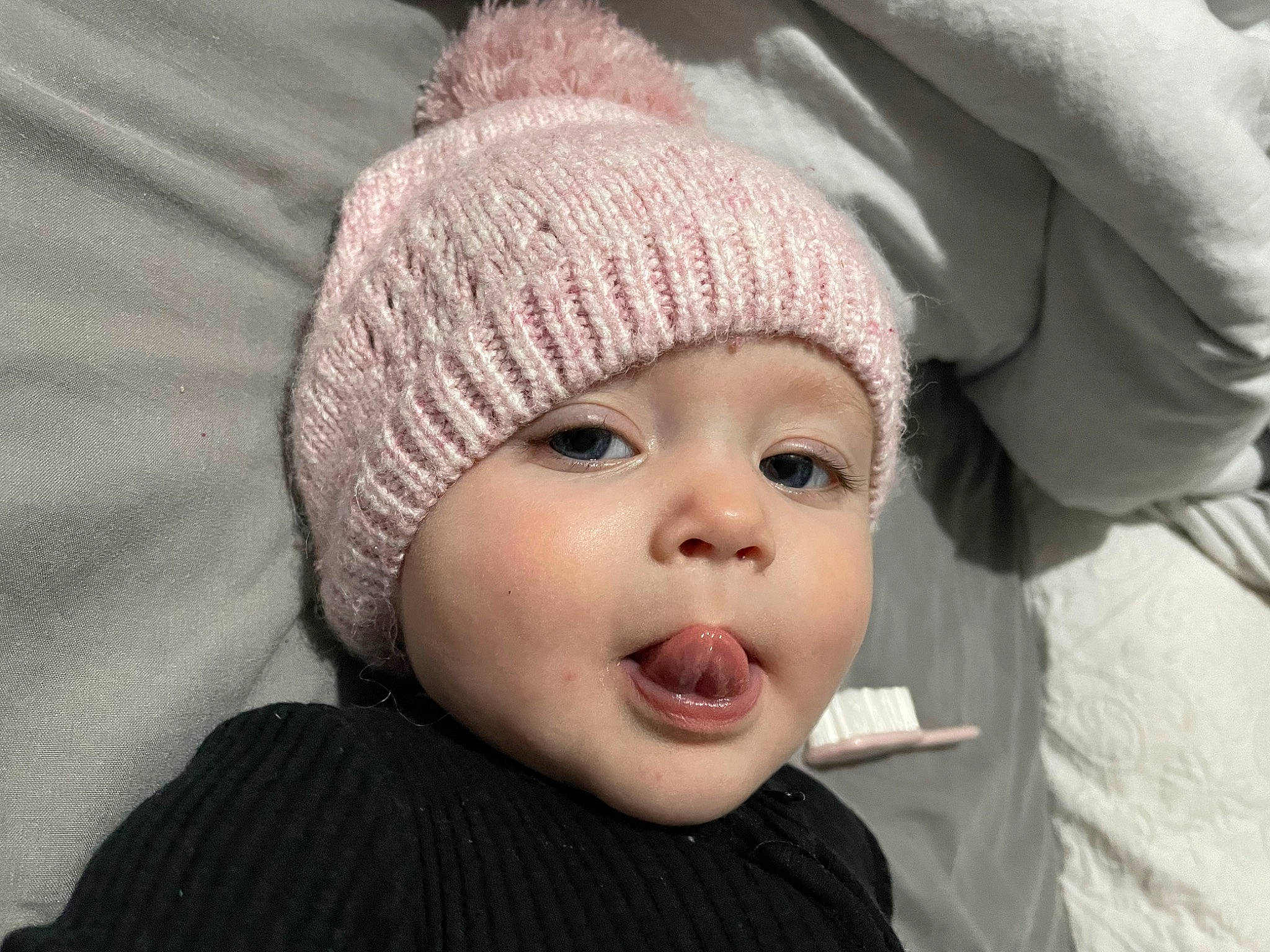 Nevaeh is registered to the contest to win money with this photo: baby, cap, cheek, child, chin, comfort, ear, eye, eyebrow, eyelash, face, head, headwear, human_body, knit_cap, lip, nose, person, skin, smile