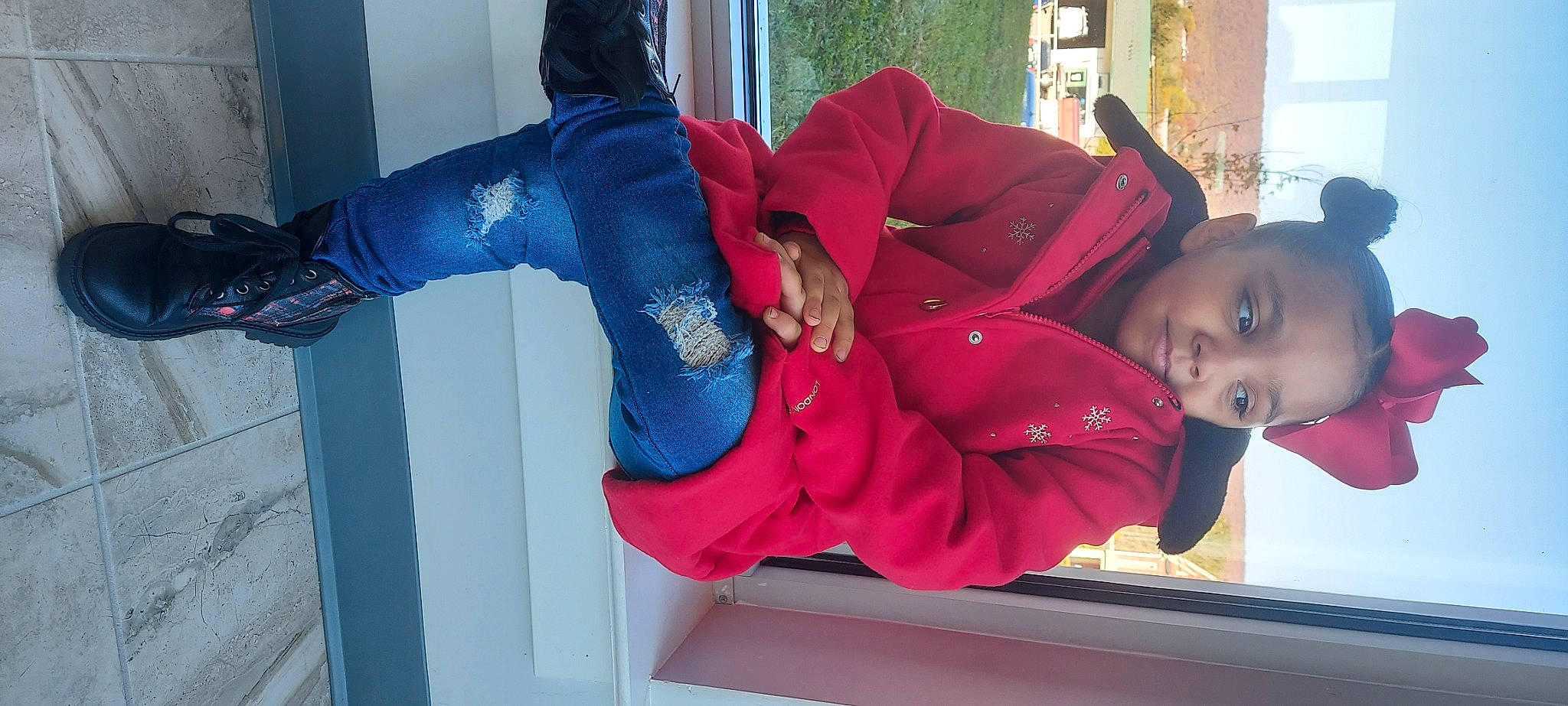 Kharinah is registered to the contest to win money with this photo: comfort, elbow, electric_blue, fun, happy, joint, leg, leisure, magenta, person, plant, red, room, sitting, smile, sportswear, street_fashion, thigh, tree, window