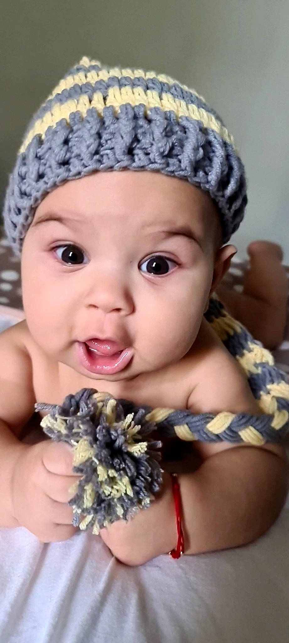 Denis is registered to the contest to win money with this photo: baby_toddler_clothing, blue, cap, cheek, eye, eyebrow, eyelash, finger, gesture, hand, happy, headwear, iris, lip, mouth, nail, organ, person, photograph, pink