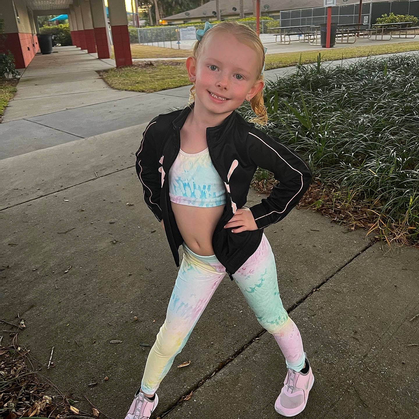 Kayleigh is registered to the contest to win money with this photo: active_pants, electric_blue, fun, grass, happy, human_leg, joy, knee, leggings, person, personal_protective_equipment, plant, recreation, sleeve, smile, spandex, sportswear, swimwear, t_shirt, thigh