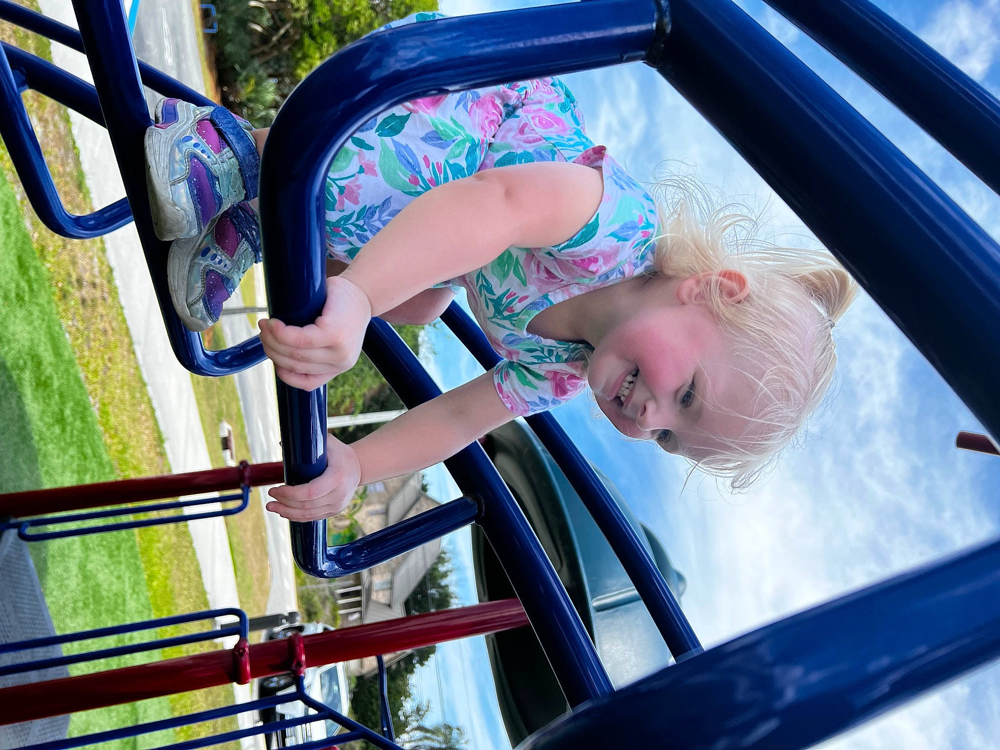 Miyah is registered to the contest to win money with this photo: auto_part, automotive_exterior, blue, child, electric_blue, fun, hand, joy, leisure, motor_vehicle, person, playground, public_space, recreation, smile, summer, t_shirt, toddler, tree, vehicle