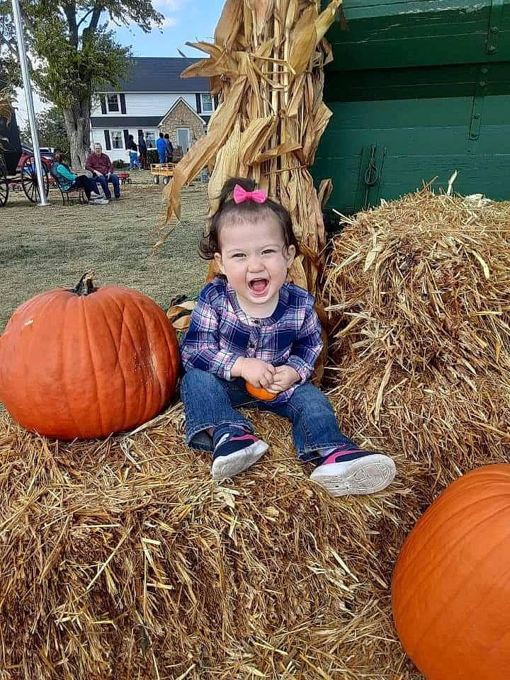 Analia joined the competition — help win amazing prizes! agriculture, calabaza, child, cucurbita, fun, gourd, grass, happy, hay, local_food, natural_foods, people_in_nature, person, plant, pumpkin, smile, squash, toddler, vegetable, winter_squash