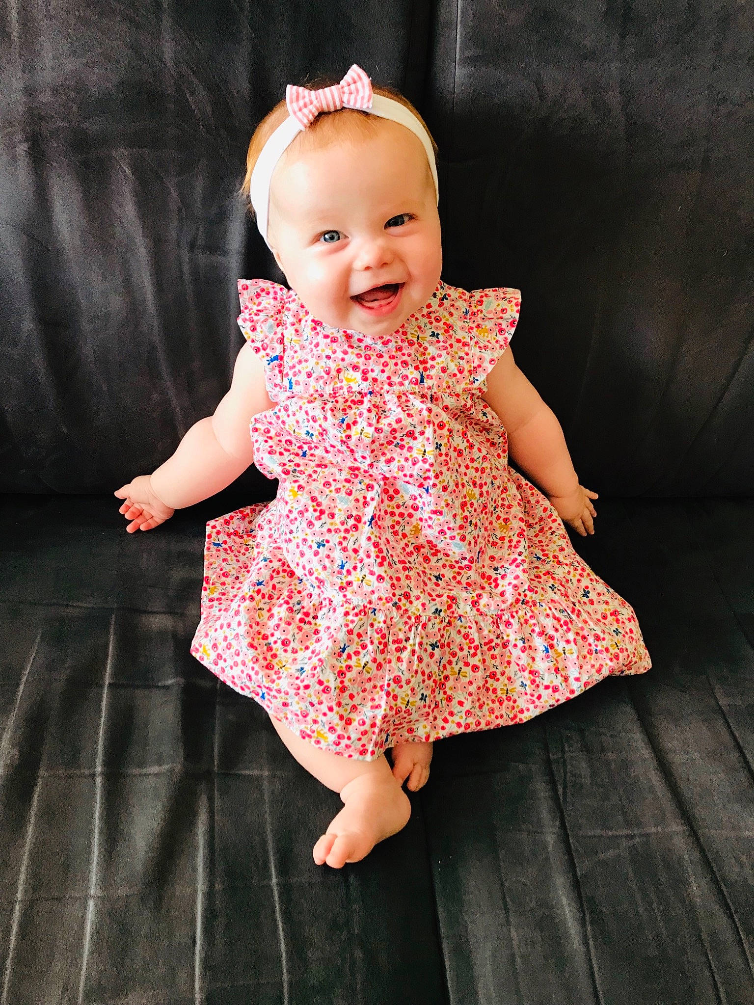 Amalia a rejoint le concours — aidez-le/la à gagner de superbes lots ! baby, baby_toddler_clothing, cheek, child, child_model, clothing, design, dress, joy, pattern, person, pink, sitting, skin, toddler