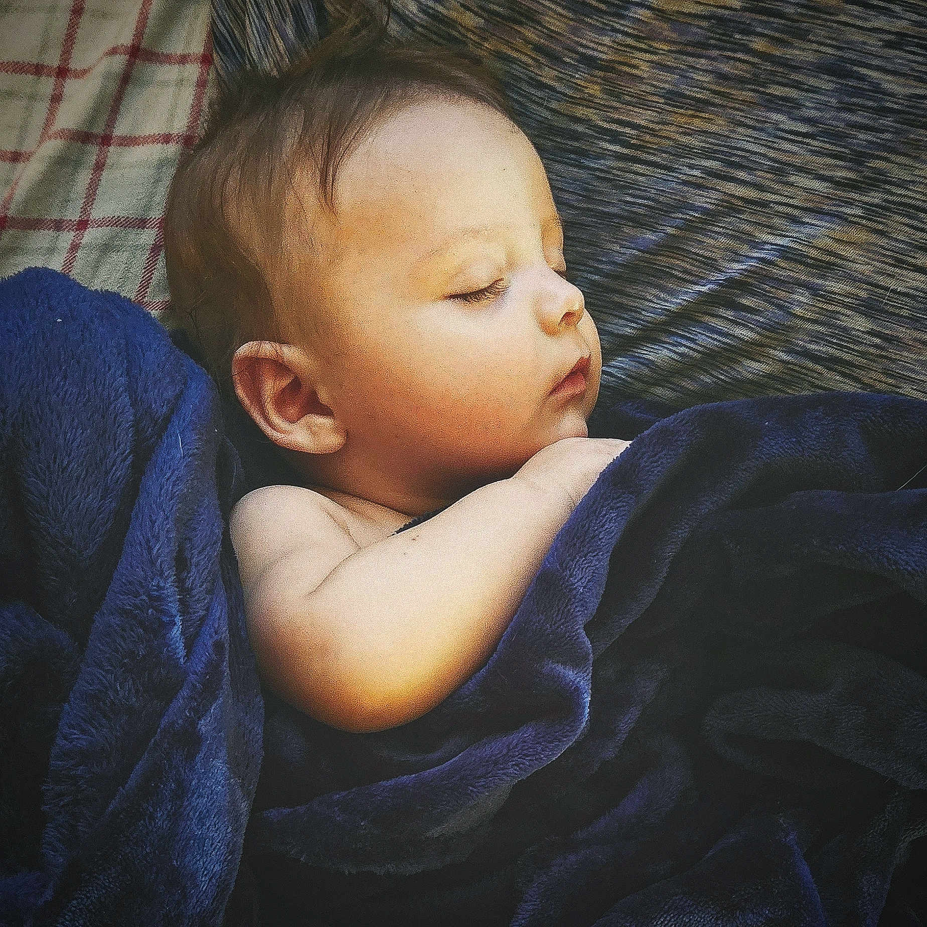 Rj Thomas is registered to the contest to win money with this photo: arm, baby, blanket, blue_blanket, child, closeup, comfort, cozy, face, head, indoors, infant, nursery, peaceful, portrait, resting, skin, sleeping, soft_lighting, young_child