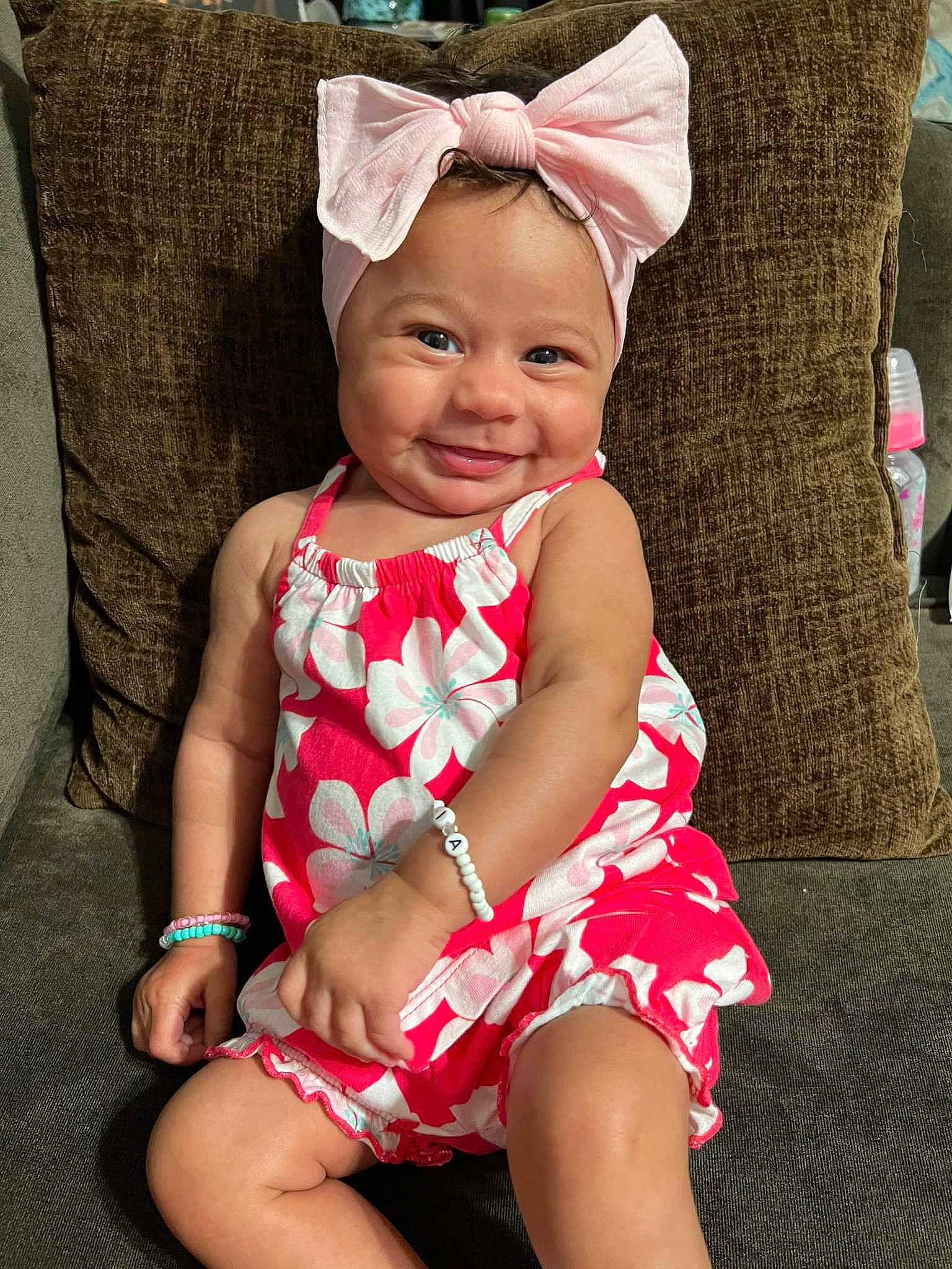 India is registered to the contest to win money with this photo: baby, baby_toddler_clothing, dress, eye, face, grass, happy, hat, head, headgear, headwear, lip, people, person, pink, skin, sleeve, smile, summer, thigh