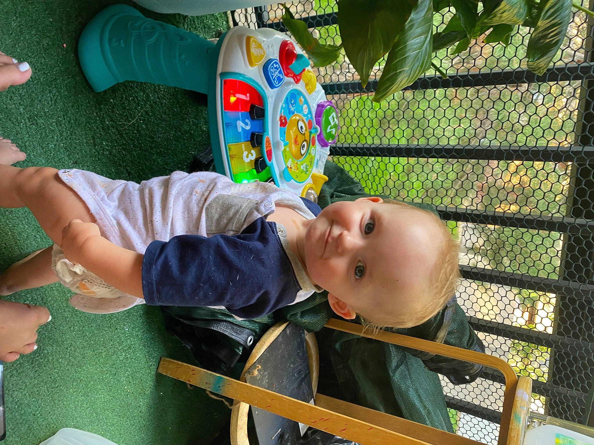 Daisy joined the competition — help win amazing prizes! baby, baby_products, baby_toddler_clothing, chair, child, foot, fun, grass, happy, leisure, people_in_nature, person, play, recreation, shorts, sitting, smile, t_shirt, toddler, vacation