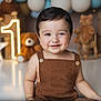Matthias joined the competition — help win amazing prizes! baby, child, smiling, brown_clothing, romper, teddy_bear, birthday, number_one, star_light, indoor, cute, portrait, happy, infant, celebration, decor, face, person, lighting, background