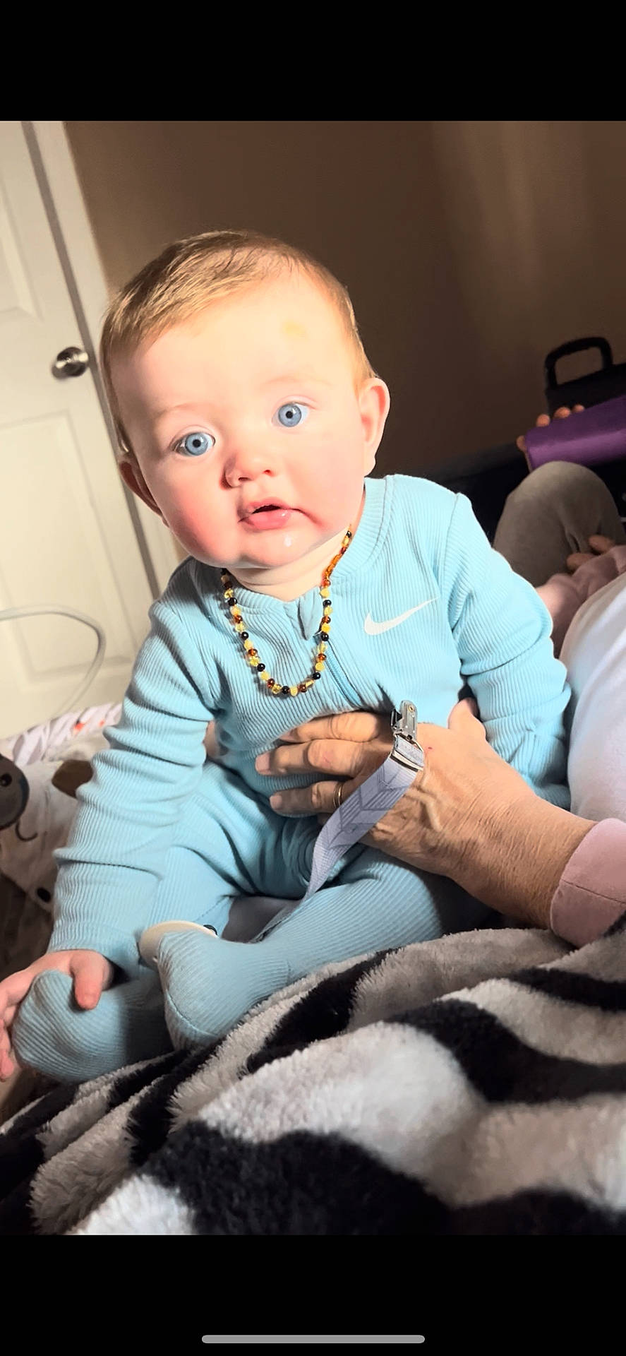 Ryker joined the competition — help win amazing prizes! accessories, baby, bodypart, clothing, couch, face, finger, furniture, hand, happy, head, jewelry, necklace, newborn, pants, person, photography, portrait, sitting, smile