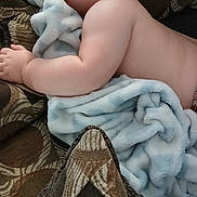 Parker is registered to the contest to win money with this photo: baby, sleeping, blanket, couch, pillow, patterned, soft, child, peaceful, relaxed, indoor, comfort, infant, skin, rest, closeup, young, toddler, nap, cozy