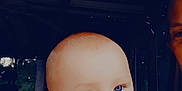 Parker joined the competition — help win amazing prizes! adult_partial, baby, background_blur, blue_eyes, child, closeup, curious, cute, expression, face, gaze, head, human, indoor, infant, naked_torso, person, portrait, skin, soft_light