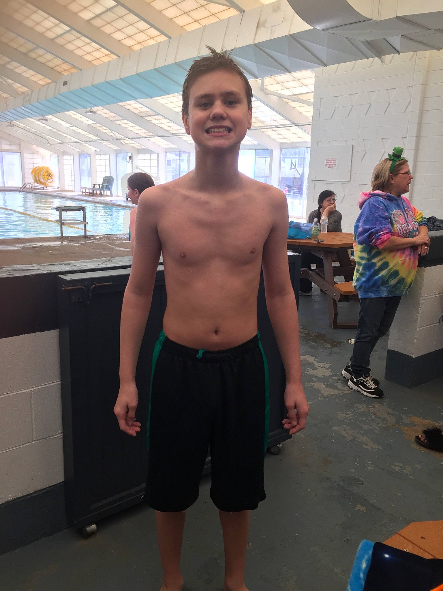 Chad is registered to the contest to win money with this photo: abdomen, arm, barechested, chest, human_body, joint, joy, leg, male, muscle, person, physical_fitness, room, shoulder, standing, trunk, trunks