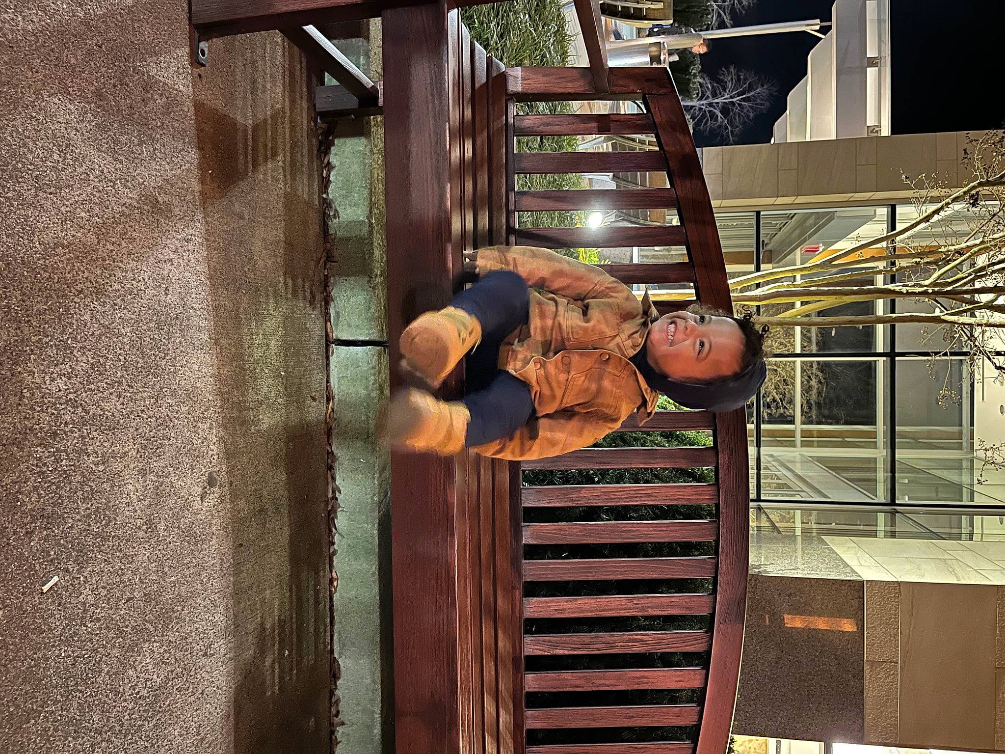 Kai is registered to the contest to win money with this photo: ball, basketball, brickwork, daylighting, door, elbow, fun, glass, handrail, hardwood, hat, leisure, metal, person, room, shorts, stairs, symmetry, tree, wood