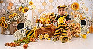 Nasya Ellie is registered to the contest to win money with this photo: baby, bee_costume, beehive, birthday, birthday_setup, black, child, daisies, decorations, flowers, honey, honeycomb, indoor, infant, number_one, picnic_basket, portrait, smiling, sunflowers, yellow